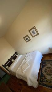 Postel nebo postele na pokoji v ubytování Brumas Ouro Preto Hostel e Pousada