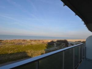 a view of the ocean from the balcony of a house at West31 with beautiful sea views in Oostduinkerke