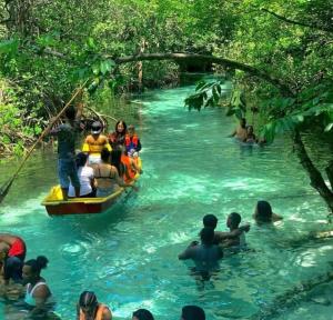 a group of people on a raft in a river at Casa refugio in Las Galeras