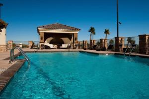 a large swimming pool with a gazebo at Radisson Hotel Yuma in Yuma