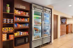 a large refrigerator with its doors open in a kitchen at Country Inn & Suites by Radisson, Phoenix Airport, AZ in Phoenix