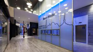 a hallway in a building with a sign on the wall at Radisson Blu Belo Horizonte Savassi in Belo Horizonte