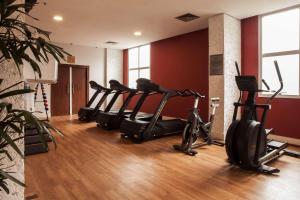 a row of exercise bikes in a gym at Radisson Alphaville in Barueri