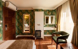 A bed or beds in a room at Golden Dream Otel