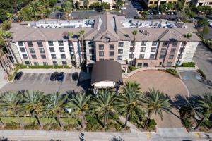 an overhead view of a hotel with palm trees at Country Inn & Suites by Radisson, Ontario at Ontario Mills, CA in Ontario