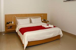 Tempat tidur dalam kamar di Radisson Diamond Barranquilla