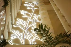 a stairway with lights on the wall at Radisson Cartagena Ocean Pavillion Hotel in Cartagena de Indias