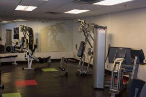 a gym with several treadmills and cardio machines at Radisson Hotel Winnipeg Downtown in Winnipeg