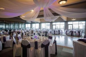 a banquet hall with tables and chairs with white table linen at Radisson Hotel Winnipeg Downtown in Winnipeg