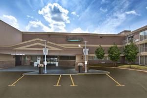 a building with a basketball hoop in a parking lot at Radisson Hotel Sudbury in Sudbury