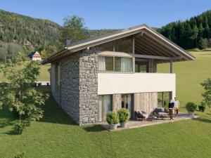 a house with people standing outside of it at Grebenzen Top Chalet Mazzel in Sankt Lambrecht