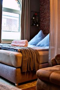 Postel nebo postele na pokoji v ubytování Industrial Style 77qm mit Balkon