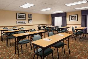 a classroom with tables and chairs in a room at Country Inn & Suites by Radisson, Columbus, GA in Columbus