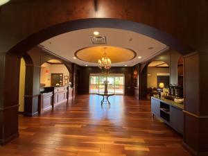 a large kitchen with an archway in a house at Country Inn & Suites by Radisson, Athens, GA in Athens