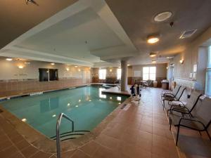 a large swimming pool in a hotel lobby at Country Inn & Suites by Radisson, Athens, GA in Athens