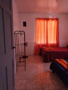 Tempat tidur dalam kamar di Anluka-House # 2