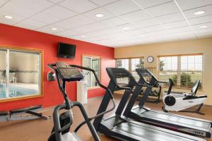 a gym with two treadmills and two ellipticals at Country Inn & Suites by Radisson, Sycamore, IL in Sycamore +25 photos