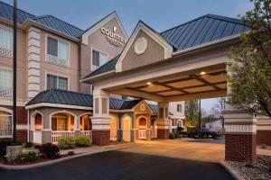a rendering of a hotel with a large building at Country Inn & Suites by Radisson, Michigan City, IN in Michigan City
