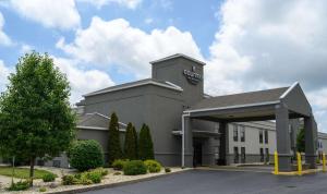 a building with a sign on the side of it at Country Inn & Suites by Radisson, Greenfield, IN in Greenfield