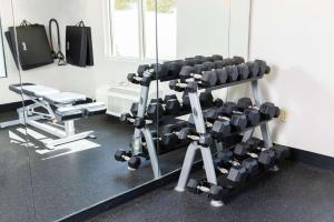 a room with a gym with a rack of weights at Country Inn & Suites by Radisson, Elizabethtown, KY in Elizabethtown