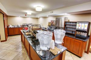 a restaurant with a counter with ice cream machines at Country Inn & Suites by Radisson, Traverse City, MI in Traverse City
