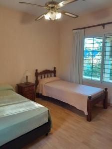 Postel nebo postele na pokoji v ubytování AlquileresVGB - La Amarella