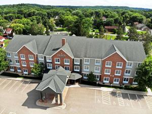 an aerial view of a school with a building at Country Inn & Suites by Radisson, Red Wing, MN in Red Wing