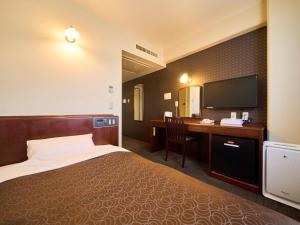 Postel nebo postele na pokoji v ubytování Minakuchi Century Hotel + 37 fotografií