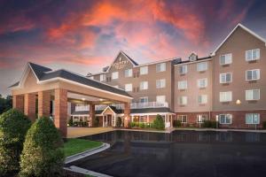a rendering of a hotel with a sunset at Country Inn & Suites by Radisson, Rocky Mount, NC in Rocky Mount