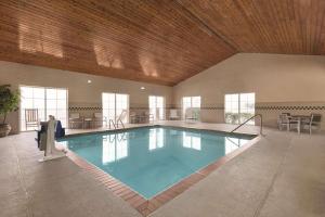 a large swimming pool in a building with a wooden ceiling at Country Inn & Suites by Radisson, Boone, NC in Boone