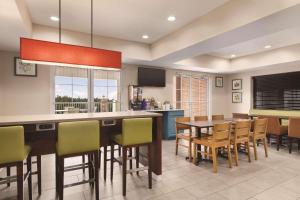 a kitchen and dining room with a table and chairs at Country Inn & Suites by Radisson, Boone, NC in Boone