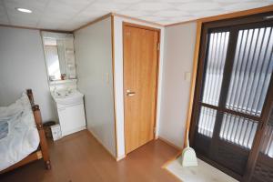 Postel nebo postele na pokoji v ubytování 農家民宿茶の香
