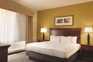 a hotel room with a bed and a window at Country Inn & Suites by Radisson, Goodlettsville, TN in Goodlettsville