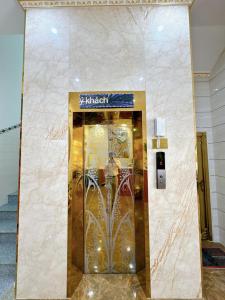 a elevator in a building with a sign on it at Sky Star 2 Hotel in Can Tho +13 photos