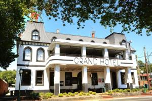 a large white building with a grand hotel at Grand Hotel Healesville in Healesville +24 photos