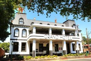 a large white building with a grand hotel at Grand Hotel Healesville in Healesville