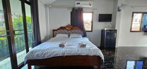 מיטה או מיטות בחדר ב-Kitti Rose Home