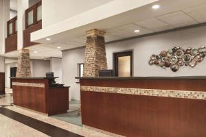 a lobby of a hospital with a reception desk at Radisson Hotel Fort Worth North-Fossil Creek in Fort Worth