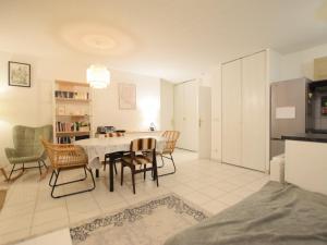 a kitchen and dining room with a table and chairs at Appartement Publier, 3 pièces, 6 personnes - FR-1-498-99 in Publier