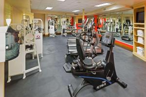 a gym with several treadmills and machines in it at Radisson Hotel El Paso Airport in El Paso