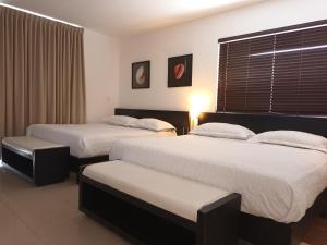 Tempat tidur dalam kamar di Playa Blanca Panama