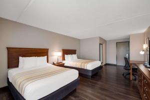 En eller flere senge i et værelse på Country Inn & Suites by Radisson, Fredericksburg South I-95 , VA