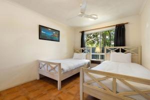 En eller flere senger på et rom på A Perfect Stay - Clarkes Beach Villa