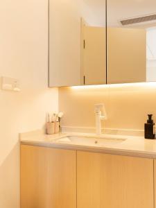 a kitchen counter with a sink and cabinets at Three Bedroom Apartment near Xintiandi in Shanghai