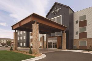 a rendering of a courtyard hotel with a building at Country Inn & Suites by Radisson, Ft Atkinson, WI in Fort Atkinson