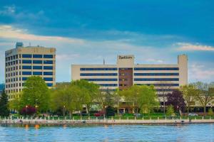 a large building in front of a body of water at Radisson Hotel La Crosse in La Crosse