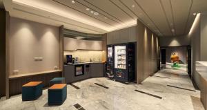 Katil atau katil-katil dalam bilik di Orange Hotel -Hanzhong, Taipei