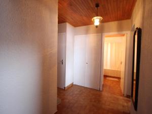 an empty hallway with a door and a ceiling at Appartement Chamrousse, 2 pièces, 6 personnes - FR-1-340-278 in Chamrousse