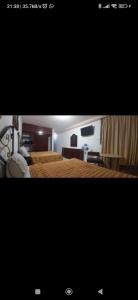 Postel nebo postele na pokoji v ubytování Hotel Estación Guadalajara