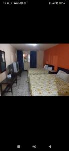 Giường trong phòng chung tại Hotel Estación Guadalajara